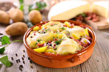 tartiflette,  baked potato,  bacon and cheese