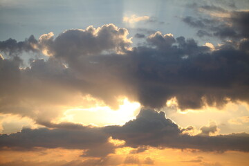 Naklejka na ściany i meble evening sky over the ocean overcast with thunderclouds sunset