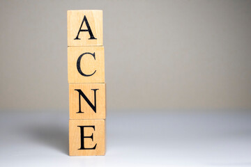 acne word in vintage wooden blocks. Close up.