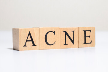 acne word in vintage wooden blocks. Close up.