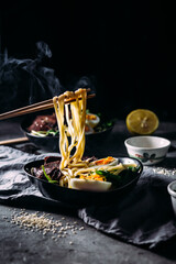 Japanese ramen soup on dark background