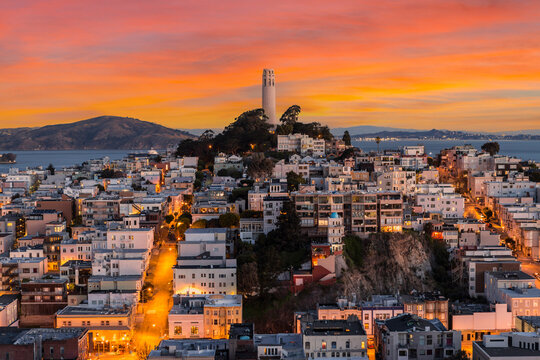 View of Coit tower with sunset sky in downtown San Francisco, California. - Powered by Adobe