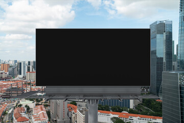 Blank black road billboard with Singapore cityscape background at day time. Street advertising poster, mock up, 3D rendering. Front view. The concept of marketing communication to promote. © VideoFlow