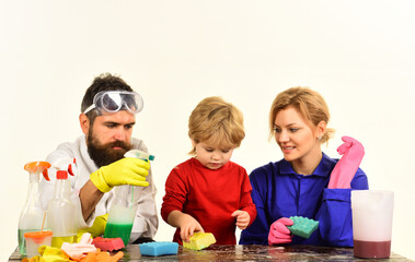 Home cleaning. Cleaning day. Family clean together. Playing with cleaning tools. Cleaning spray. Desinfection. Soap. Rubber gloves.