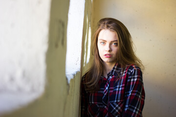 Fototapeta premium portrait of a young woman in shirt . Girl with blue eyes and red lips