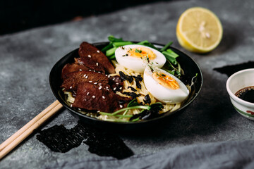 Japanese ramen soup on dark background
