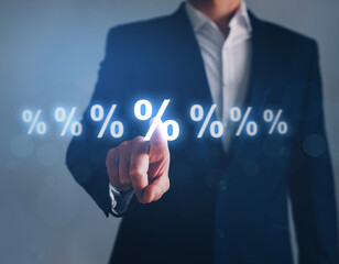Businessman pointing digital percentage symbol. Interest rate financial and mortgage rates.