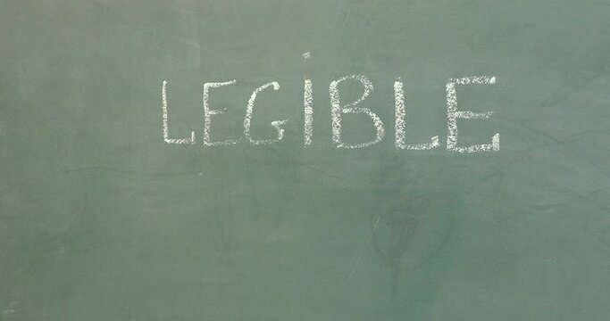 Word legible illegible wipe erase on a green class board