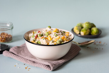 Frozen vegetable mix made from rice, peas, corn and pepper.