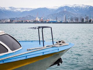 The nose of the boat and the black sea