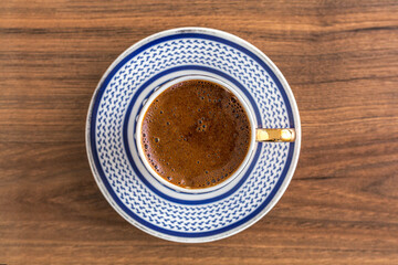 Traditional turkish coffee on wood background. Closeup turkish coffee on wood table