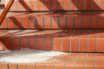 Snow on brick steps
