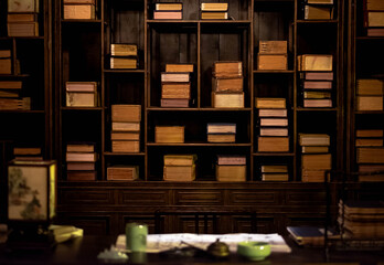 The chinese traditional bookshelf  with the  chinese decoration on the wood table in the old library.