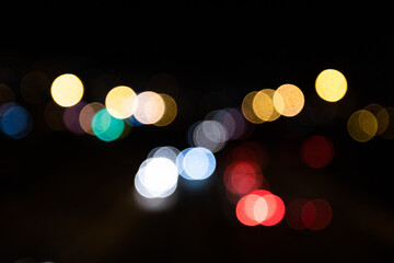 Blurred out of focus colorful lights from the cars on the motorway