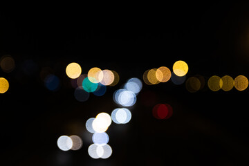 Blurred out of focus colorful lights from the cars on the motorway