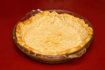 an empty pie crust waiting to be filled with banana crème pudding