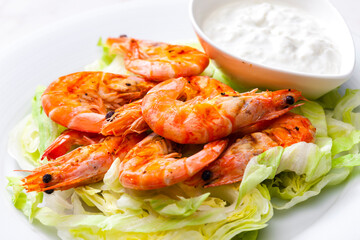 still lfe of grilled shrimps with garlic dip