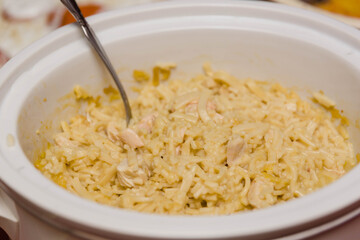 a casserole dish filled with homemade noodles for a holiday meal