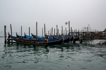 Fototapeta na wymiar Gondolas in front of St. Marco square in Venice, Italy