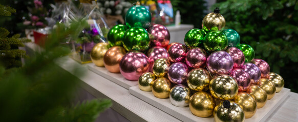 Christmas balls on the stand. Close-up of Christmas toys in a store