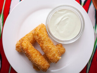 cheese sticks - fried breaded cheese served with creamy sauce. Asian style