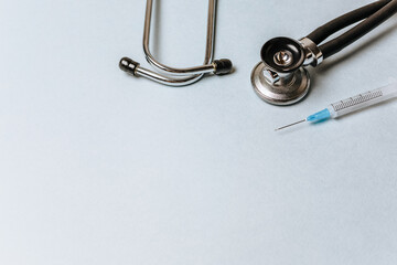 Medical concept flat lay with stethoscope on a blue background