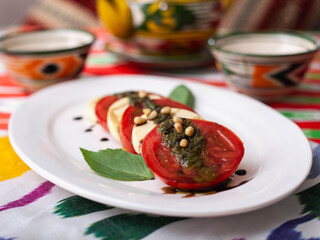  Italian caprese salad with tomatoes, mazzarella cheese and balsamic sauce. Asian style