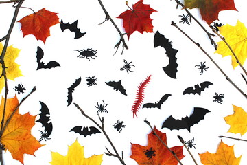 Obraz premium Halloween-themed autumn background with bats leaves and cockroaches