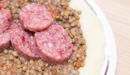 Italian pork sausage served with lentils