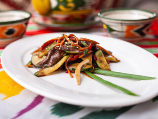  Eastern warm salad. Fried pieces of beef, marcovi and cucumbers in sauce and sesame seeds. Asian style