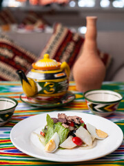 Salad with tuna. Salad with eggs, herbs, onions, cherry tomatoes, and tuna. Asian style