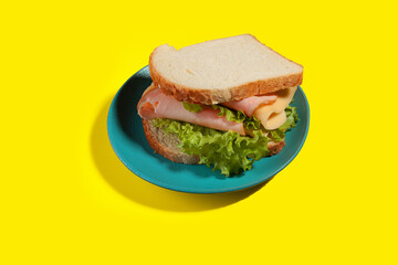 Sandwich of bread, salad, meat and cheese