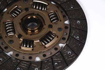 Close-up of a new auto clutch disc. Spare parts for car maintenance and service