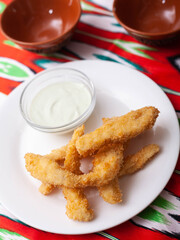 chicken nuggets - and breaded fried chicken served with a creamy sauce. Asian style