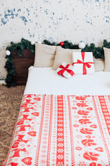 Christmas bedroom interior with bed Christmas tree presents new year as background