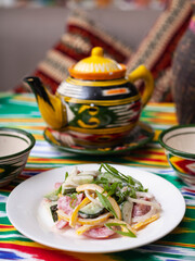 Creamy salad of green and red peppers, cheese, eggplant, onions and tomatoes Asian style