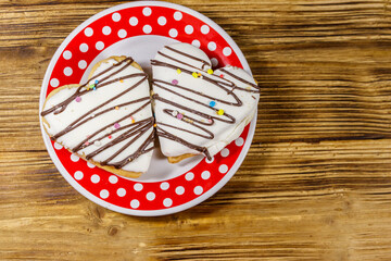 Heart shaped cookies on wooden table. Top view. Dessert for Valentine day