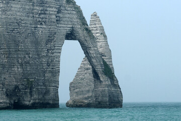 Natural arch and a pointed formation called Needle, which rises 70 metres above the sea. Cold windy...