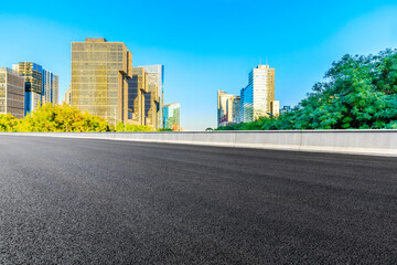 Empty asphalt road and modern cityscape in Beijing,China.