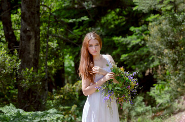 Young girl with a wreath of wild flowers