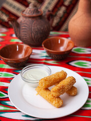 cheese sticks - fried breaded cheese served with creamy sauce. Asian style