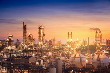 Obraz na płótnie Canvas Oil and gas refinery plant or petrochemical industry on sky sunset background, Factory with evening, Manufacturing of petrochemical industrial
