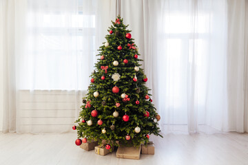 Christmas tree with gift decoration balls garlands new year interior