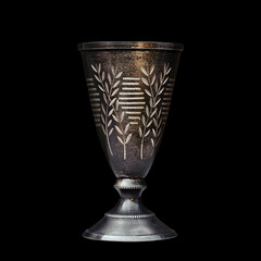 silver Cup with patina isolated on a black background