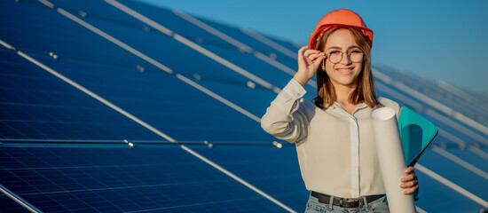 Businesswomen working on checking equipment at solar power plant with tablet checklist, woman...