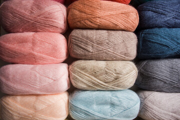 Background from skeins of multicolored threads for knitting