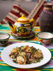  Fried potatoes with pieces of meat. Asian style