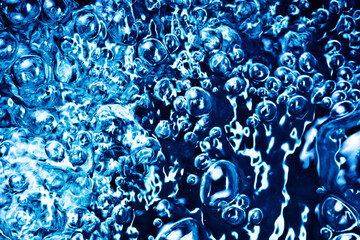 Boiling water bubbles. Air bubble background. Fizzy water texture.
