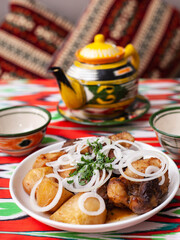  An oriental dish of grilled beef, potatoes and onions with herbs. Asian style