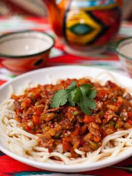  The oriental dish guiru lagman is homemade noodles fried with meat, vegetables and herbs. Eastern cuisine